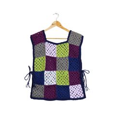 Please carefully read item description and shop policies This one-of-a-kind up-cycled vest is hand-crafted from a recycled crocheted blanket - Approximately 60 hours of work Size: This vest is designed to fit from a small to a large with adjustable side ties (please see measurements) Composition: 100% acrylic - One-of-a-kind Hand Crafted in Canada Measurements (taken laying flat): Length: 21.5"  Bust/Chest: 34" - This is the width of each panel - Side ties are ~12"  Strap width: 5.5" It is recom Granny Square Vest, Crocheted Blanket, Vest Outfits, Blanket Sizes, Shop Policies, Panel Siding, Granny Square, Womens Vest, Final Sale