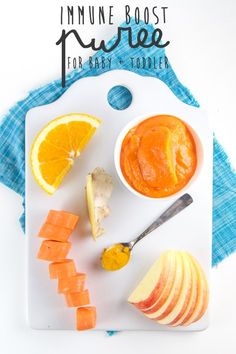 an apple, carrots and orange slices on a cutting board with the words innumee boost sauce for grey lodge