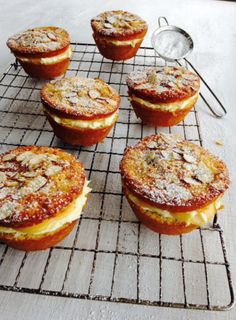 several pastries are cooling on a wire rack