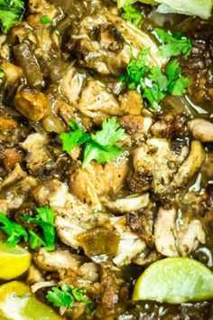 chicken with lemons, parsley and cilantro in a skillet