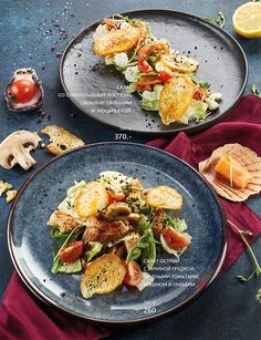 two plates filled with food on top of a blue table cloth next to each other