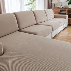 a living room with a large sectional couch