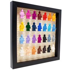 legos are arranged in a shadow box to look like they have different colored figures on them