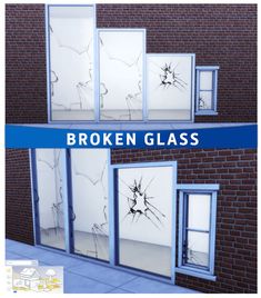 broken glass is displayed in front of a brick building with windows that have been smashed