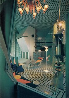 the interior of an art deco home with geometric patterns and lighting fixtures, including chandeliers