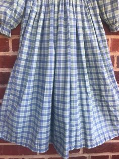 "Adorable prairie style dress so cute on/no sz tag or fabric labels/soft and cozy feels like a very lightweight flannel definitely has cotton or is all cotton/pit to pit 10 1/2\"-11\"Has some stretch /waist 10 1/2\"/pit to wrist 11\"/Elasticized wrists/length 34\"/Smoke free environment- adorable on throw on a pair of boots and you have a Little House on the Prairie!Color did not photograph well outside see last picture for more accurate color(34)" Vintage Summer Dress With Smocked Cuffs, Vintage Style Smocked Dress For Spring, Spring Plaid Cotton Smocked Dress, Spring Vintage Smocked Dress With Smocked Bodice, Peasant Dresses With Smocked Cuffs For Daywear, Vintage Spring Dresses With Smocked Cuffs, Vintage Dresses With Smocked Cuffs For Spring, Spring Vintage Dresses With Smocked Cuffs, Spring Gingham Dresses With Smocked Cuffs