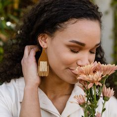 YEWO's Pawalo Bead Earrings offer beautiful and unique design with a guaranteed ethical origin. Crafted by Malawian artisans trained in an eco-friendly solar-powered workshop, each earring is intricately handwoven with Japanese glass beads. Choose a special piece that not only complements any outfit but also stands for ethical craftsmanship and conscious production. 3.5" Gold-filled hoops with Japanese Glass Beads Simply buff with the pad until the patina is lifted and the piece shines Fair Trade Adjustable Earrings, Earthy Handwoven Jewelry For Gifts, Fair Trade Beaded Dangle Earrings, Fair Trade Artisan Earrings, Artisan Woven Natural Jewelry, Artisan Natural Woven Jewelry, Elegant Handwoven Natural Jewelry, Elegant Handwoven Jewelry, Artisan Handwoven Beaded Drop Earrings