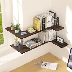 a computer monitor sitting on top of a desk next to a book shelf filled with books