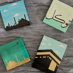 four small paintings with arabic writing on them