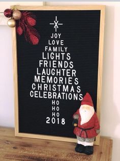 a wooden sign with a santa clause on it