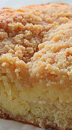 a close up of a piece of cake on a plate with some bread crumbs