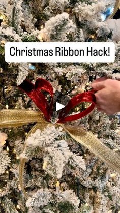 someone is decorating a christmas tree with ribbons and bows for the holiday season,