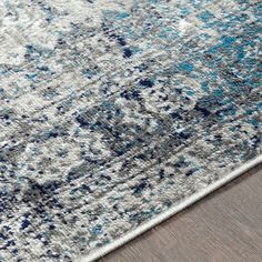 an area rug with blue and gray colors