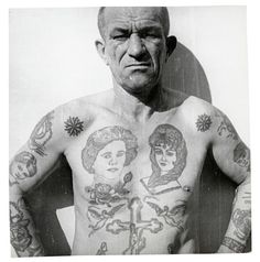 an old man with tattoos on his chest