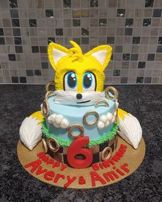 a birthday cake with an image of a fox on it's face and the number six