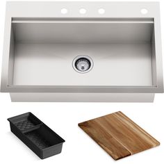 a stainless steel kitchen sink and cutting board