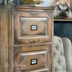 a close up of a drawer with books on top