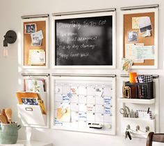 a chalkboard with writing on it is attached to the wall next to a desk