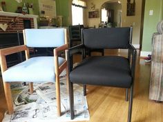 two chairs sitting on top of a hard wood floor