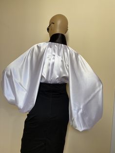 "This is a very stylish Womens Satin blouse. It is comfortable and cozy. Made for a free flowing fit. Black high collar and cuffs. Satin covered buttons Great for all year around and for any special occasion or casual day can be dressed up or dressed down. SIZE CHART SIZE S - US 6, UK 8, EU 36 bust: bust around 34.5\"/90cm Waist: waist around 27.5\"/70cm Hips: hips around 34.5\"/90cm SIZE M - US 8, UK 10, EU 38 bust: bust around 37.5\"/95cm Waist: waist around 29.5\"/75cm Hips: hips around 37.5\ Classic White Satin Blouse, Elegant Lantern Sleeve Blouse For Night Out, Elegant Padded Blouse With Balloon Sleeves, Elegant Blouse With Balloon Sleeves And Padding, Elegant Blouse With Padded Balloon Sleeves, Silk Collar Blouse For Party, Formal Padded Bishop Sleeve Blouse, Classic Formal Blouse With Balloon Sleeves, Elegant Satin Collared Top