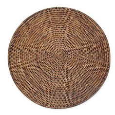 a round wicker placemat on a white background