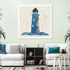 a living room with two white couches and a blue lighthouse painting on the wall