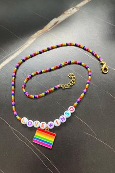 Beautiful, handmade pride necklace. seed beads and a rainbow flag charm. length: 20 inches  closure: lobster clasp  charm: alloy charm  Please feel free to reach out to me with any questions or to discuss a custom order. Pride Necklace, Love Wins, Friend Gifts, Rainbow Flag, Seed Bead Necklace, Necklace Handmade, Bead Necklace, Best Friend Gifts, Seed Bead