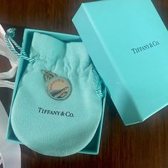 New With Box, Pouch, And Ribbon! This Charm Is No Longer Available In Stores Or On The Website. Perfect Condition And Has Room To Be Engraved On The Back Would Look Great On A Bracelet, Necklace, Key Ring, Etc! Sterling Silver Rare And Very Difficult To Find Limited Edition Charm Tiffany Blue Color, Jewelry Tiffany, Return To Tiffany, Box Pouch, Tiffany Co Jewelry, Tiffany Blue, Bracelet Necklace, Tiffany & Co., Key Ring