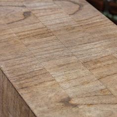 a close up view of a wooden table with no one on it's surface