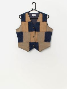 90s vintage denim patchwork vest waistcoat. This 1990s indigo blue denim vest features a beautiful brown and denim patchwork pattern, a V-neck and a full length button closure. Made from a mid-weight cotton. Our recommended size: Large Label says: Medium Condition: Very good Material: 100% cotton Measurements in inches: Pit to pit: 20 Shoulders: 14 Front length: 22.5 Back Length: 18.5 Hem: 17 We recommend that you compare our measurements to a similar item of your own to ensure good fit. Measure Vest Diy Pattern, Denim Vest Pattern, Fitted Cotton Denim Vest With Patchwork, Casual Denim Patchwork Vest, Vintage Patchwork Vest For Summer, Vest Patchwork Vintage, Patchwork Waistcoat, Sleeveless Patchwork Denim Vest, Cardboard Masks