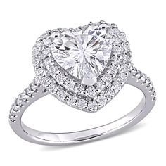 a heart shaped diamond ring with double halos