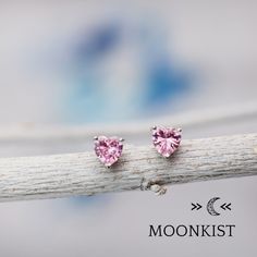 Great for everyday wear, these Pink Tourmaline CZ heart earrings feature 6 mm heart shaped faceted gemstones, hand set in sterling silver 3 prong stud earring mountings. These mountings are firmly soldered and tumble polished for hours to increase durability. The posts on these earrings are 11 mm (.45 inches) long, and sterling silver clutch backs are included with your purchase. CZ (cubic zirconia) is a laboratory grown gemstone that has a hardness similar to topaz and quartz. It is available i Pink Heart-shaped Gemstone Earrings, Pink Heart Gemstone Earrings, Sterling Silver Heart Earrings With Gemstones, Heart-shaped Gemstone Earrings As Gift, Sterling Silver Heart Earrings With Birthstone, Sterling Silver Heart Cut Birthstone Earrings, Sterling Silver Heart Earrings With Gemstone For Valentine's Day, Heart Cut Earrings With Heart Charm For Mother's Day, Heart Cut Heart Charm Earrings For Mother's Day