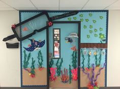 a classroom door decorated with under the sea theme and marine life on it's sides