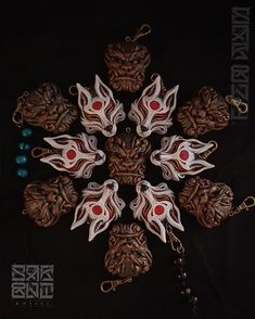 a snowflake made out of wood and metal with red eyes on it's face