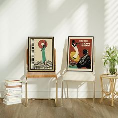 two chairs sitting next to each other in front of a wall with posters on it