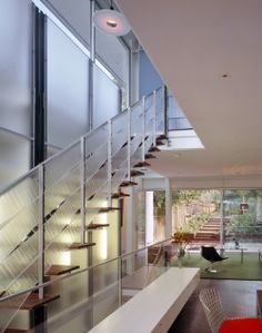 the stairs are made of glass and steel