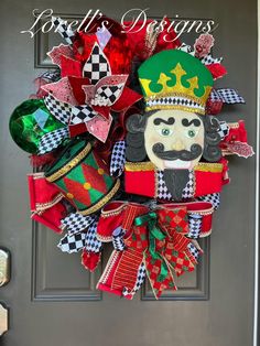 the front door is decorated with colorful christmas wreaths and decorations, including an image of a nutcracker