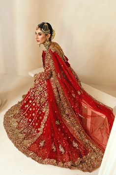 Embellished Heavy Zardozi Work on Red and Gold Lehenga Choli is a Beautiful Traditional Attire to make you look pretty in its design and maroon-colored dress; an evergreen color for a desi bridal attire. In red chiffon lehenga and net dupatta. Choli: Chiffon fabric Red Pakistani Bridal Dress in Red and Gold Lehenga Choli is embellished with a Mughal geometric design in kamdani, sequins, Swarovski, Resham, and dabka. The base color used for choli is Maroon. It can be turned into a gown instead of Red Pakistani Bridal Dress, Red Bridal Lehenga Pakistani, Bridal Lehenga Pakistani, Chiffon Lehenga, Lehenga Pakistani, Red Bridal Lehenga, Evergreen Color, Pakistani Bridal Lehenga, Pakistani Brides