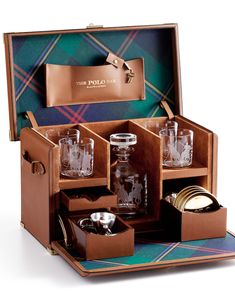 an open leather case with glassware in it