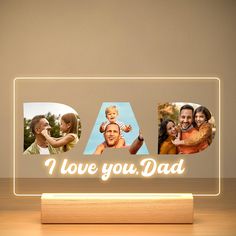 an illuminated acrylic photo frame with the words i love you dad