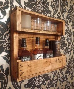 a wooden shelf with bottles and glasses on it