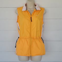 Nike Nylon Running Vest. Size Small 4 - 6. Orange (Please See Pix With Crayons To Get The Best Idea), White And Navy Blue. Full Zip. Two Side Slit Pockets, No Inner Pockets. Adjustable Cinch Waistband. Like New But Please See The 6th Pix As There Is A Darker Orange Mark Below The Left Back Shoulder That Might Just Be A Variation In The Fabric. It Is Smaller Than A Dime And Barely Noticeable. Other Than That It Looks To Be Brand New. Please See Photos For Measurements Laying Flat. Thank You Nike Hoodies For Women, Yellow Nikes, Nike Crewneck, Running Vest, Grey Long Sleeve Shirt, White Crew Neck, Training Tops, Back Shoulder, Nike Tees