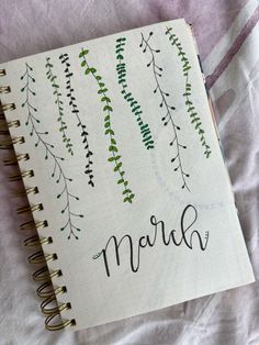 a notebook with the word march written in cursive writing