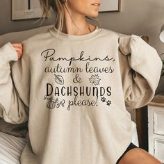 Fall Dachshund Sweatshirt for Women, Doxie Mom Sweater, Dog Mom Sweatshirt, Dachshund Mom Gift for Fall Wardrobe, Wiener Dog Holiday Gift This Dachshund Fall sweatshirt is perfect for all dachshund moms! Wear this Dachshund sweater if you love your Doxie and want to show off how awesome they are. Wear this warm sweater to a pumpkin farm, Thanksgiving dinner or around town to show your love for your adorable wiener dog! This Fall sweatshirt would also make a great gift for your favorite hot dog d Fall Crew Neck Top With Dog Print, Fall Cotton Sweatshirt With Dog Print, Cotton Dog Print Sweatshirt For Fall, Long Sleeve Dog Print T-shirt For Fall, Cotton T-shirt With Dog Print For Fall, Fall Dachshund, Farm Thanksgiving, Dachshund Stuff, Cricut Stickers