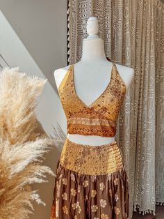 Choose bralette only, skirt only, or the two piece set~  BRALETTE DETAILS Gorgeous halter tie-back silk bralette in our stunning Desert Solstice© print! Perfect for a summer top, or fall layering.  S/M recommended for busts 30-34" L/XL recommended for busts 36-40" 2/3X recommended for busts 42-46"  SKIRT DETAILS Made from a beautiful lightweight silk blend fabric in our exclusive Desert Solstice© print. This airy, feminine skirt features multiple tiers for a flattering, flowy look + twirls that Beach Season Halter Neck Vacation Sets, Fitted Skirt Set For Beach Summer, Bohemian Sleeveless Sets For Beach Season, Two-piece Skirt Set For Summer Vacation, Two-piece Cropped Beachwear Sets, Two-piece Cropped Beach Set, Cropped Beach Sets For Summer, Cropped Sets For Beach In Summer, Two-piece Crop Top For Summer Vacation