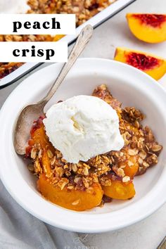 a white bowl filled with fruit and topped with ice cream next to another bowl full of peach crisp