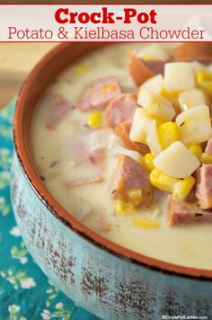 a bowl of potato and kielbasa chowder with ham in it on a blue table cloth