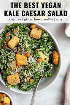 two bowls filled with salad and croutons on top of a white countertop