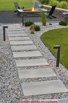 a stone path leading to a fire pit