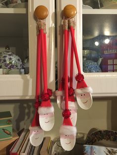 some red and white christmas decorations hanging from the wall